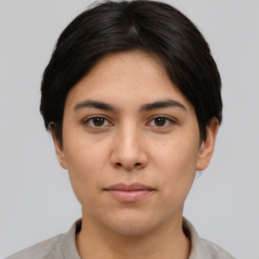 Neutral white young-adult female with short  brown hair and brown eyes