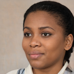 Joyful black young-adult female with medium  brown hair and brown eyes