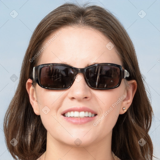 Joyful white young-adult female with medium  brown hair and blue eyes