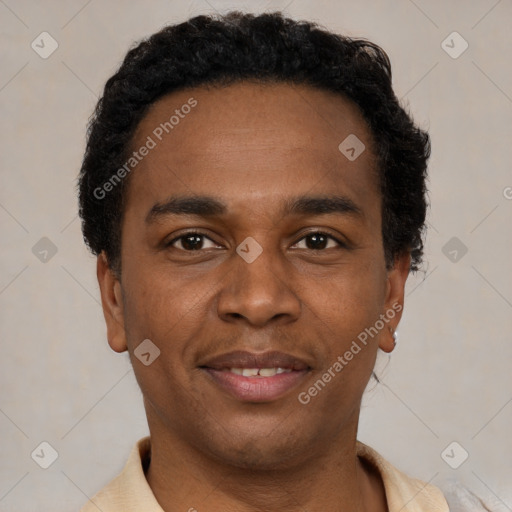 Joyful black young-adult male with short  black hair and brown eyes