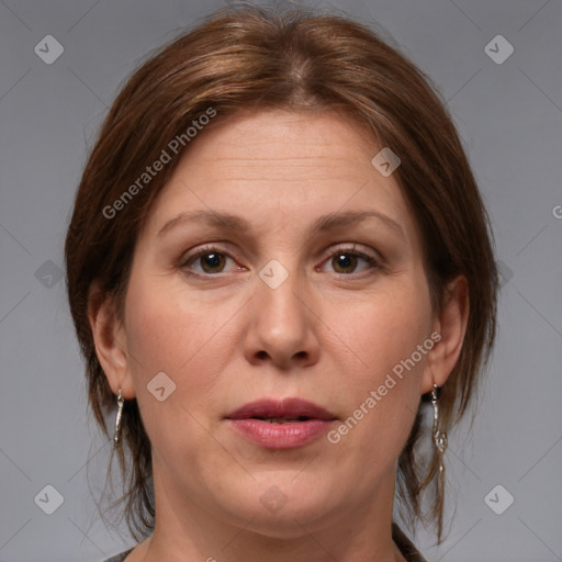 Joyful white adult female with medium  brown hair and brown eyes