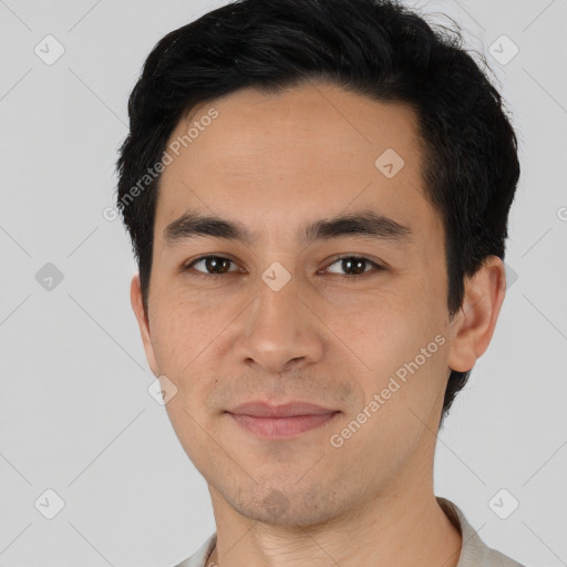 Joyful asian young-adult male with short  black hair and brown eyes