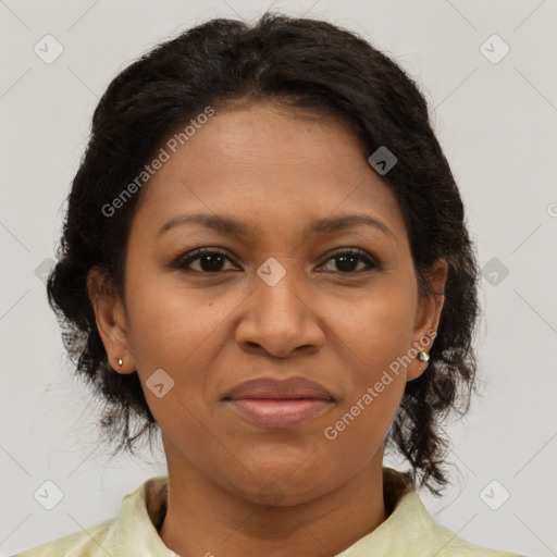 Joyful black adult female with medium  brown hair and brown eyes