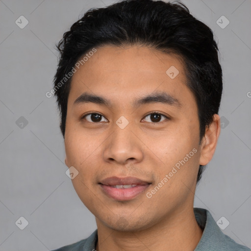 Joyful latino young-adult male with short  black hair and brown eyes