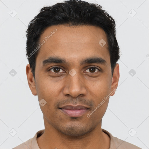 Joyful latino young-adult male with short  black hair and brown eyes