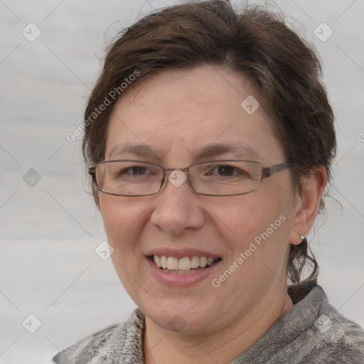 Joyful white adult female with short  brown hair and grey eyes