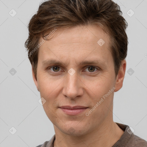 Joyful white adult male with short  brown hair and grey eyes