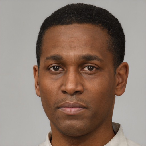 Neutral black young-adult male with short  black hair and brown eyes