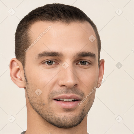 Joyful white young-adult male with short  brown hair and brown eyes