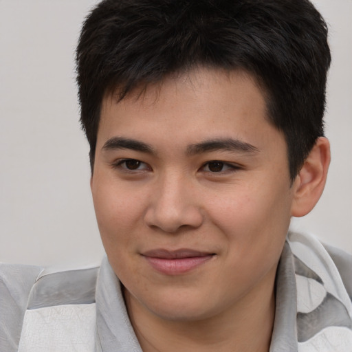 Joyful asian young-adult male with short  brown hair and brown eyes