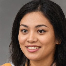 Joyful asian young-adult female with long  brown hair and brown eyes