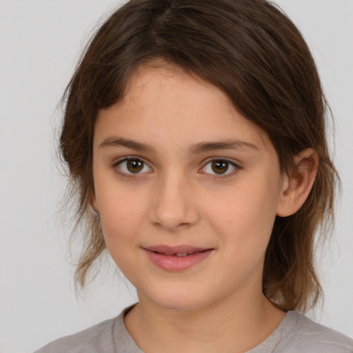 Joyful white child female with medium  brown hair and brown eyes