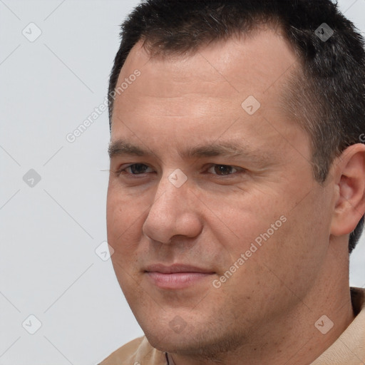 Joyful white adult male with short  brown hair and brown eyes