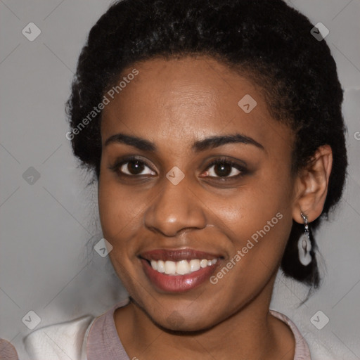 Joyful black young-adult female with medium  brown hair and brown eyes