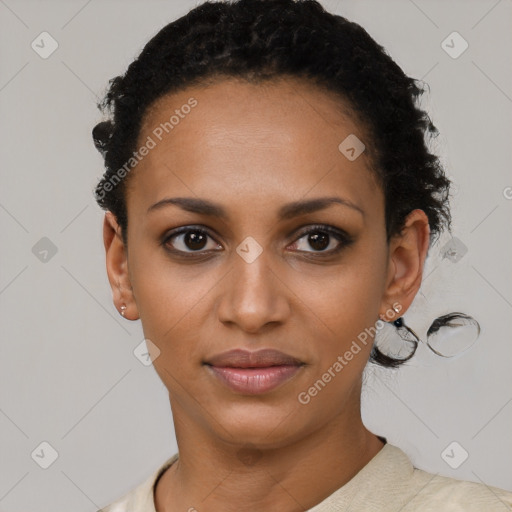 Joyful black young-adult female with short  brown hair and brown eyes