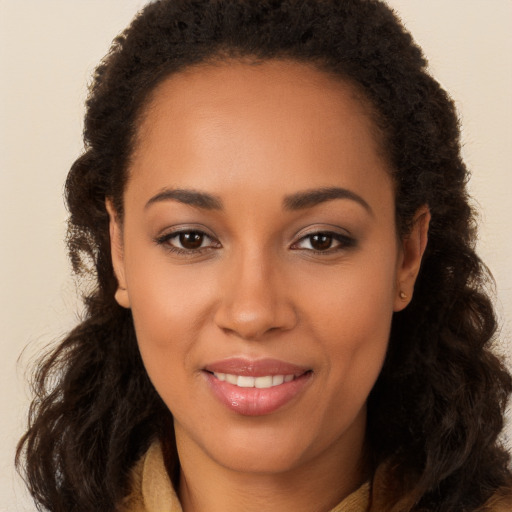 Joyful latino young-adult female with long  brown hair and brown eyes