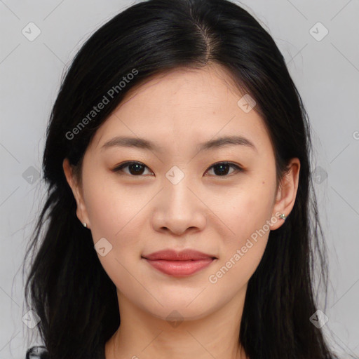 Joyful asian young-adult female with long  brown hair and brown eyes