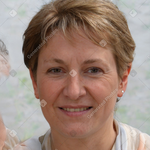 Joyful white adult female with short  brown hair and brown eyes