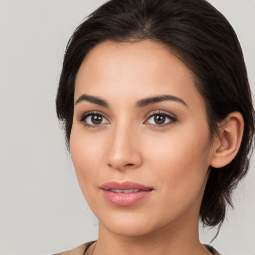 Joyful white young-adult female with medium  brown hair and brown eyes