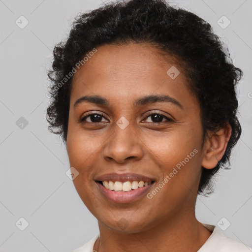 Joyful latino young-adult female with short  brown hair and brown eyes