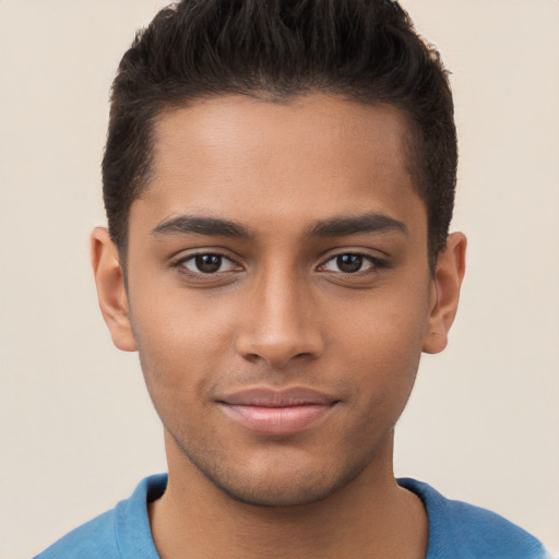 Joyful black young-adult male with short  brown hair and brown eyes