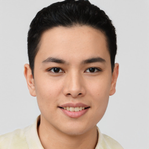 Joyful asian young-adult male with short  brown hair and brown eyes