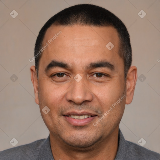 Joyful white adult male with short  black hair and brown eyes