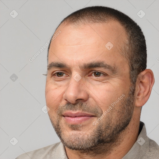 Joyful white adult male with short  black hair and brown eyes