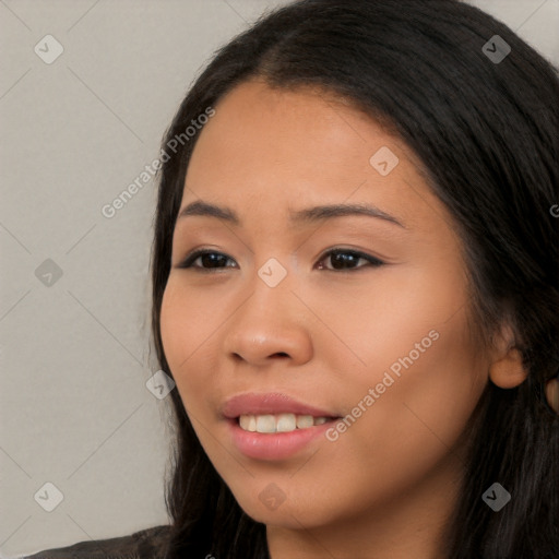 Joyful white young-adult female with long  black hair and brown eyes