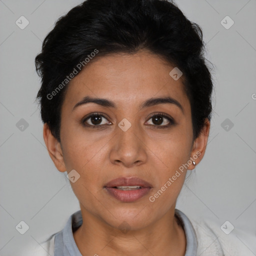 Joyful latino young-adult female with short  black hair and brown eyes