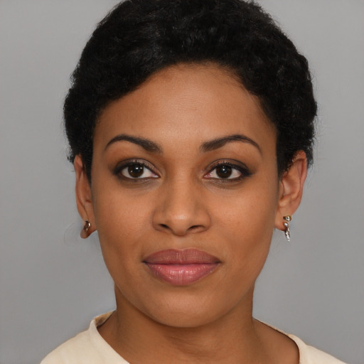 Joyful latino young-adult female with short  brown hair and brown eyes