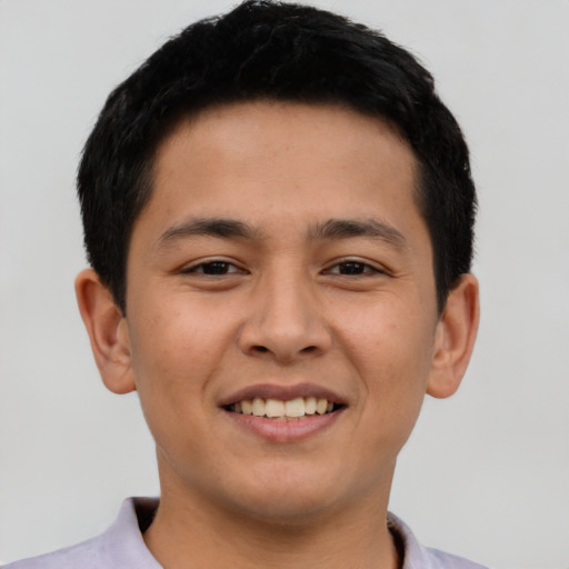 Joyful latino young-adult male with short  brown hair and brown eyes