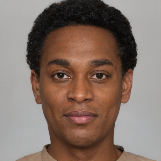 Neutral black young-adult male with short  black hair and brown eyes