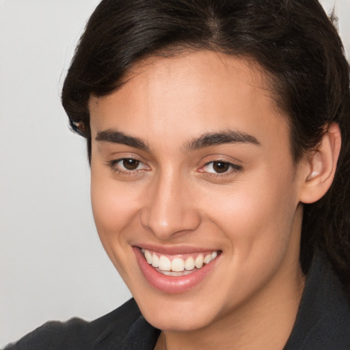 Joyful white young-adult female with medium  brown hair and brown eyes