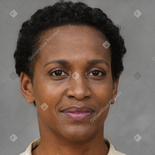 Joyful black adult female with short  brown hair and brown eyes