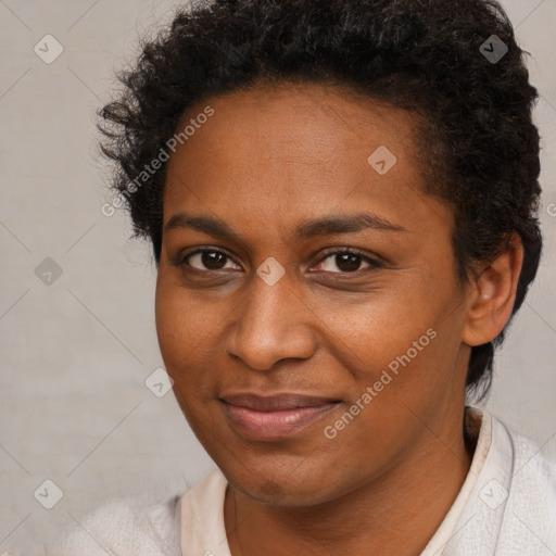 Joyful black adult female with short  brown hair and brown eyes