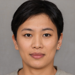 Joyful asian young-adult female with short  brown hair and brown eyes