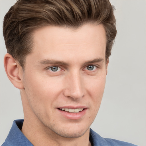 Joyful white young-adult male with short  brown hair and grey eyes