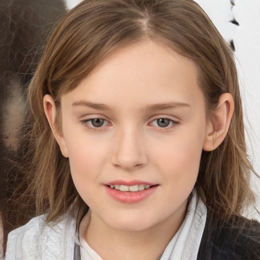 Joyful white child female with long  brown hair and brown eyes