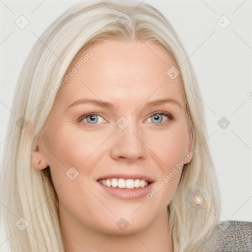 Joyful white young-adult female with long  blond hair and blue eyes