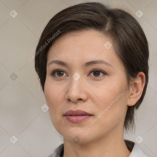 Joyful white adult female with medium  brown hair and brown eyes