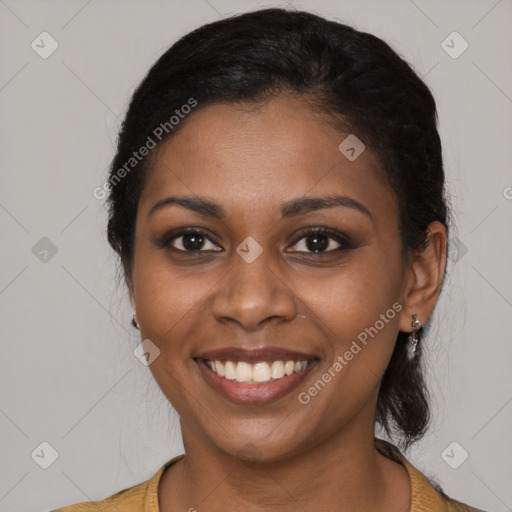 Joyful black young-adult female with medium  black hair and brown eyes