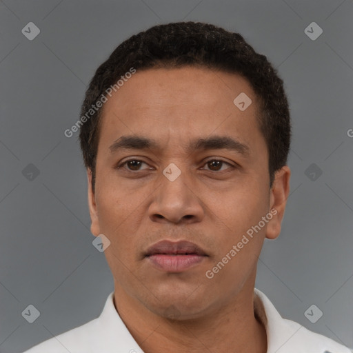 Neutral latino adult male with short  black hair and brown eyes