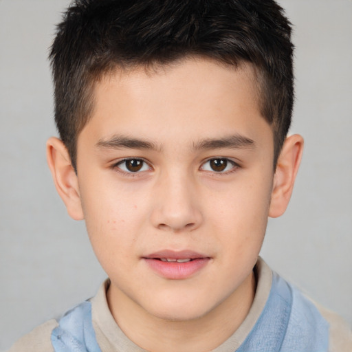 Joyful white child male with short  brown hair and brown eyes