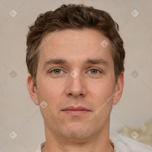 Joyful white adult male with short  brown hair and grey eyes