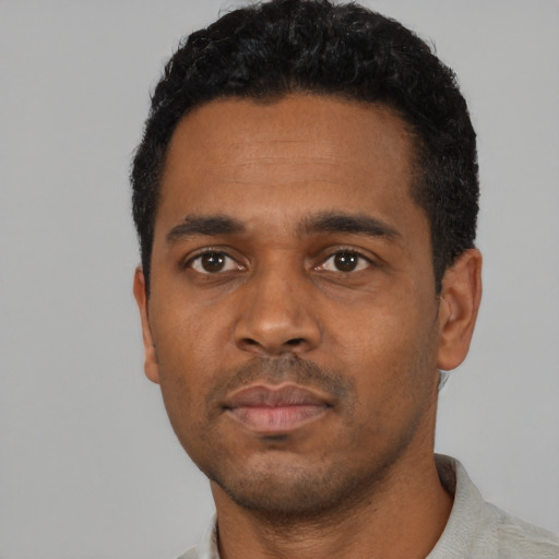 Neutral black young-adult male with short  black hair and brown eyes