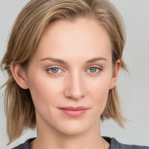 Joyful white young-adult female with medium  brown hair and blue eyes