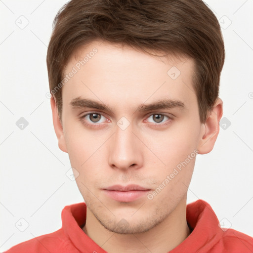 Neutral white young-adult male with short  brown hair and grey eyes