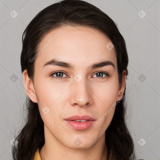 Neutral white young-adult female with long  brown hair and brown eyes