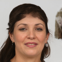 Joyful white adult female with medium  brown hair and grey eyes